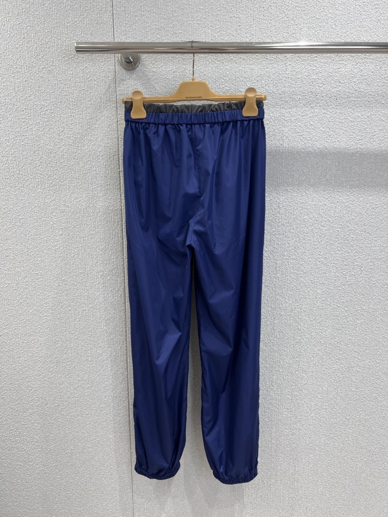 Miu Miu x New Balance Navy Blue Track Pants - Luxury Streetwear Joggers with Red Embroidered Logo, Zippered Pockets, and Elasticated Cuffs