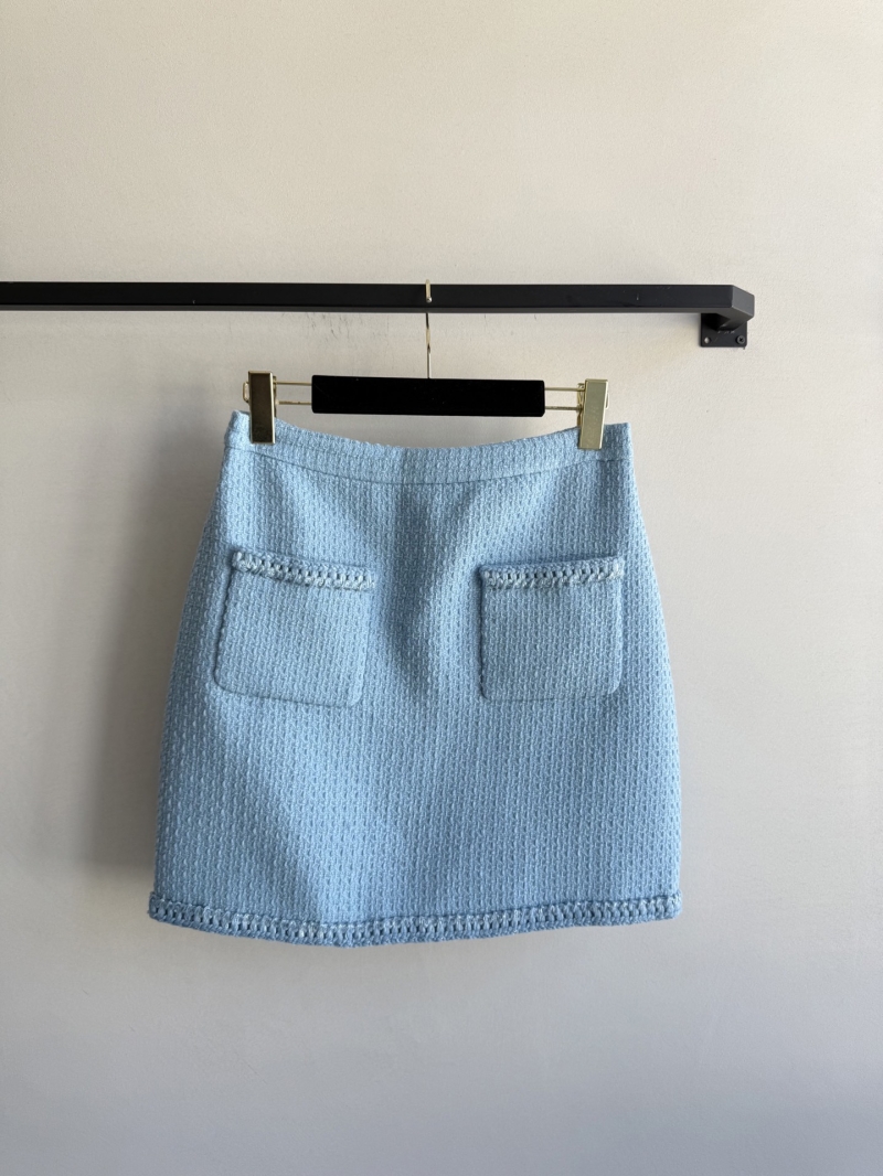 Chanel Women's Light Blue Tweed Mini Skirt, Exquisite Craftsmanship, Signature Metal Buttons, Couture-Inspired Pockets, Tailored Fit for Effortless French Elegance