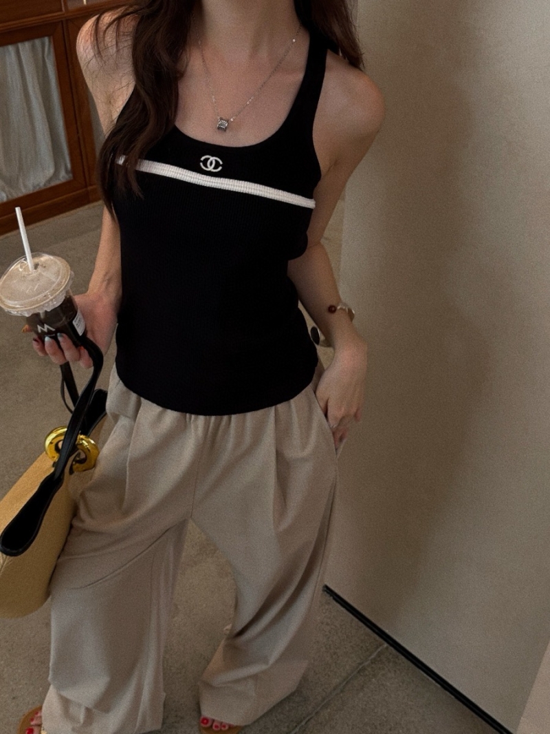 Chanel Black Luxe Sleeveless Dress with V-Neckline and Contrasting White Stripe