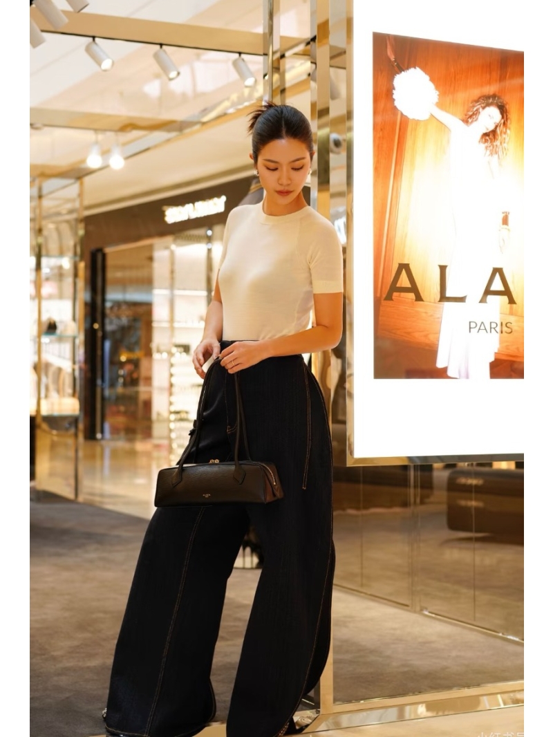 Alaia Low-Rise Petal-Hem Sculptural Denim Jeans